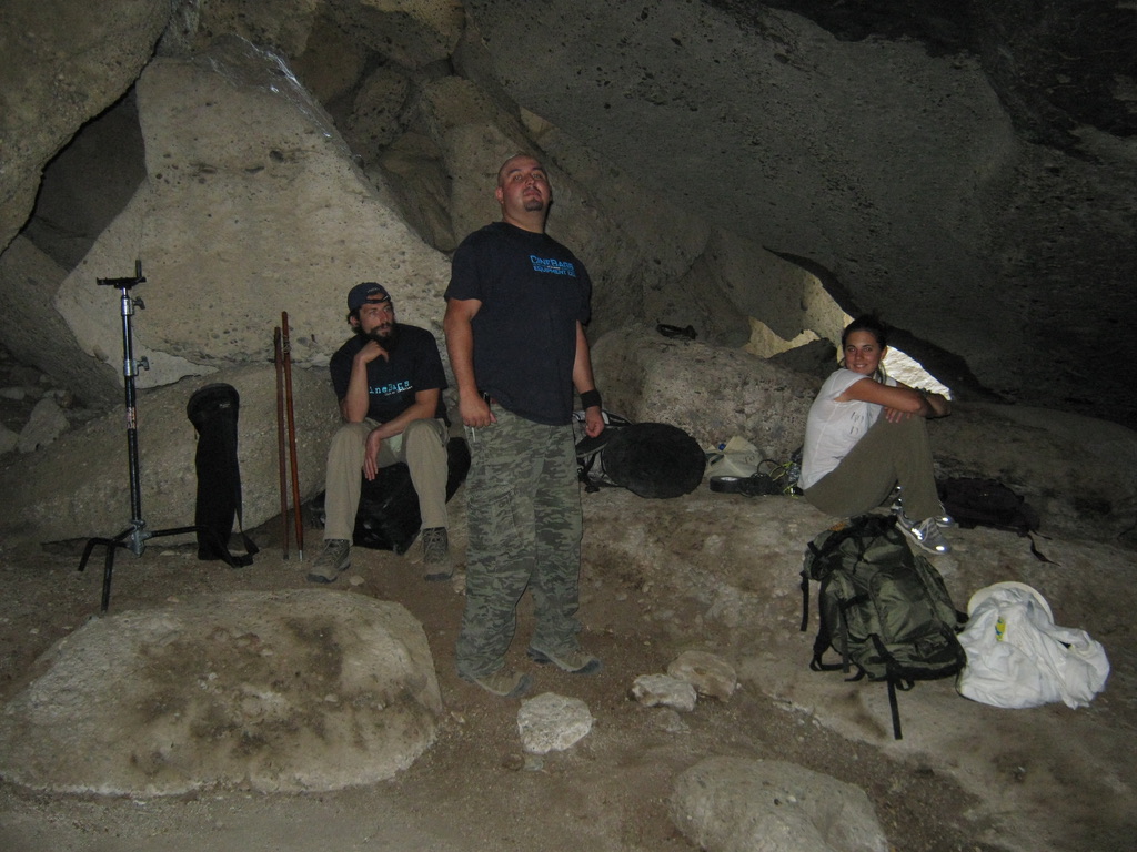 ON LOCATION IN THE CAVE — THE CREW BETWEEN SETUPS