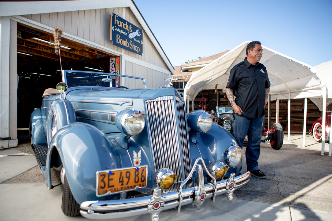 RANDY PEREZ WITH HIS '36 PACKARD AT THE BOMB SHOP