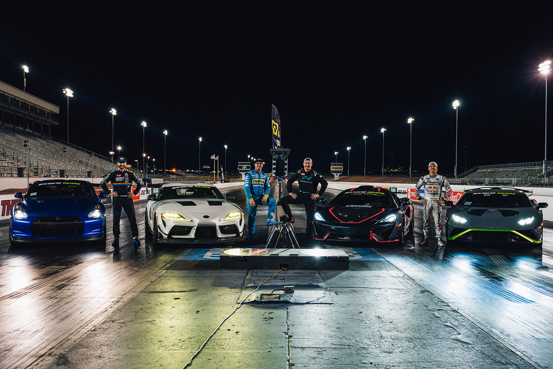 ON THE STARTING LINE — THE COMPETITION FIELD AND DRIVERS UNDER THE LIGHTS