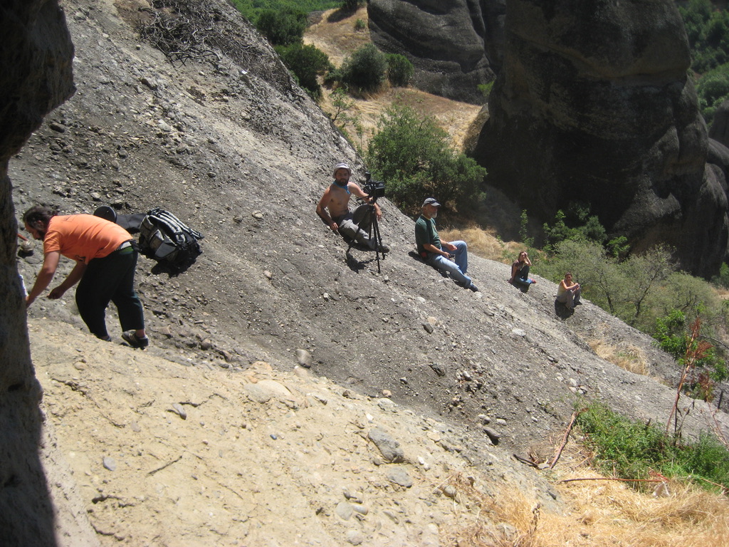 ON LOCATION AT METEORA — CREW CLIMBING THE SANDSTONE PILLARS