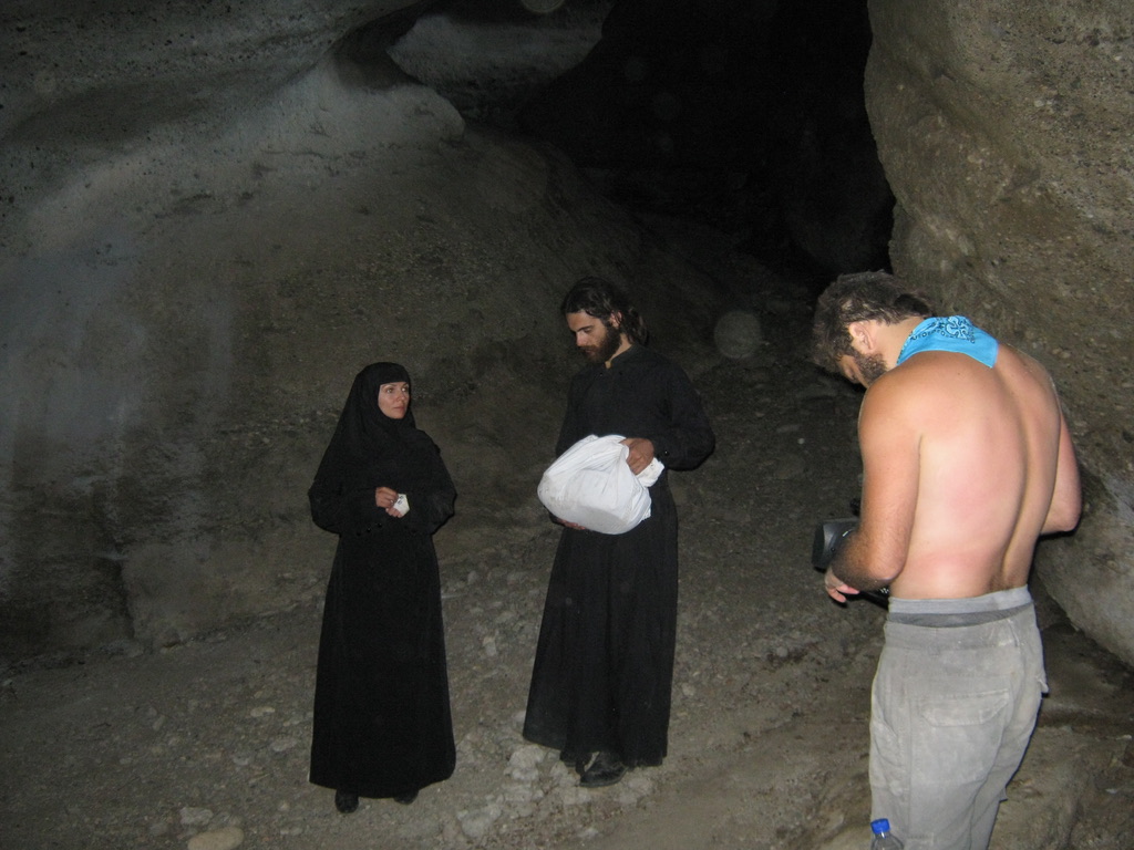 ON SET IN THE CAVE — SHOOTING THE MONK AND NUN BY AVAILABLE LIGHT