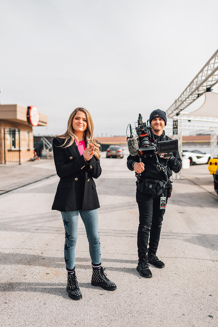 HOST AND CAMERA OP BETWEEN SETUPS AT DREAM RACING