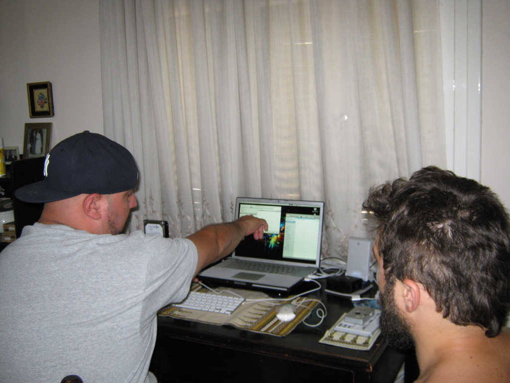 ON LOCATION IN GREECE — REVIEWING THE CUT WITH THE DIRECTOR