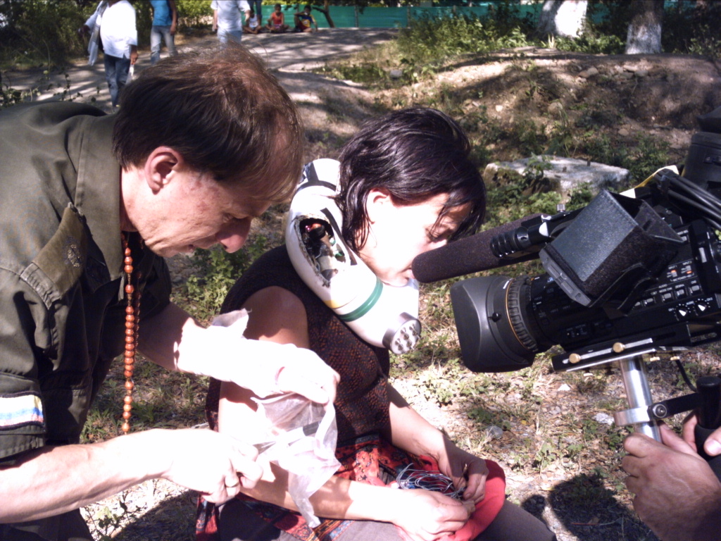 THE BOMB COLLAR RIG ON SET BETWEEN TAKES — A PRECISION PROP BUILT FOR THE SINGLE TAKE.