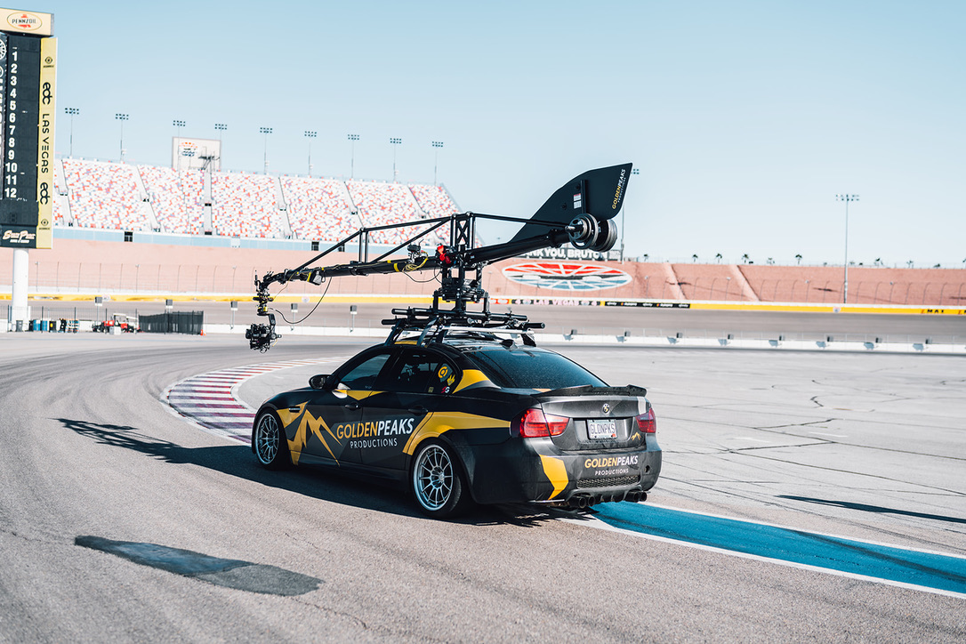 CRANE ON THE CAMERA CAR — DAYTIME ROAD COURSE COVERAGE