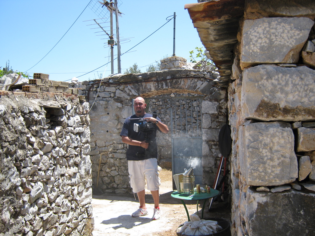 ON LOCATION IN GREECE — CAMERA READY IN THE VILLAGE COURTYARD